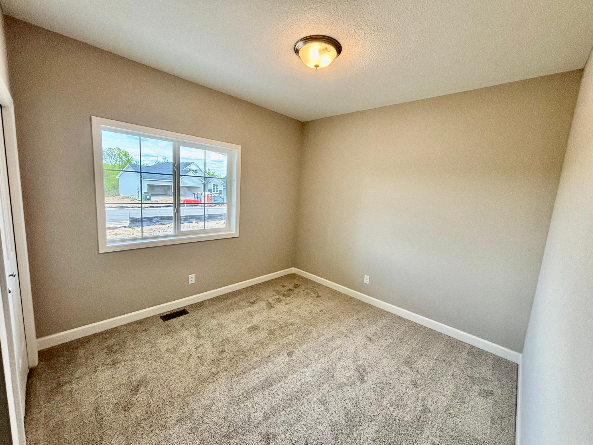 Main Level Bedroom 2 - The Madison Rambler at 937 Kepler Ave NE in Oakview Ridge!