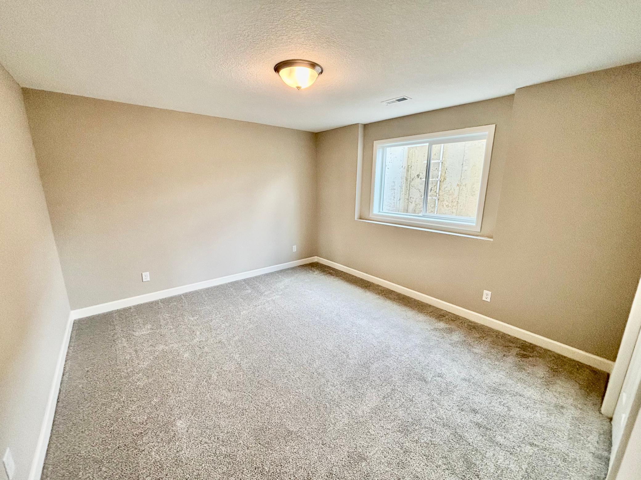 Lower Level Bedroom 4 - The Madison Rambler at 937 Kepler Ave NE in Oakview Ridge!