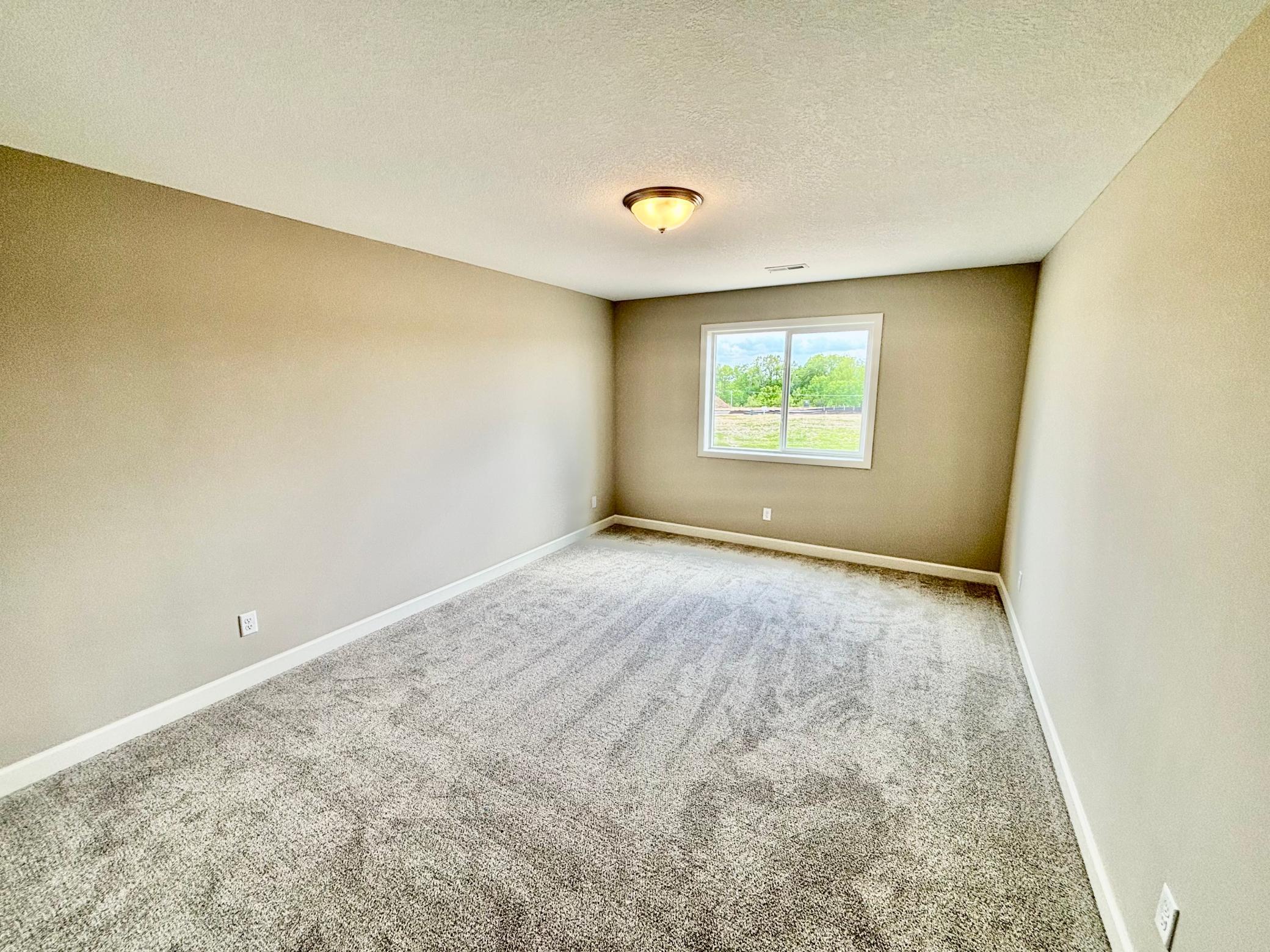 Lower Level Bedroom 5 - The Madison Rambler at 937 Kepler Ave NE in Oakview Ridge!