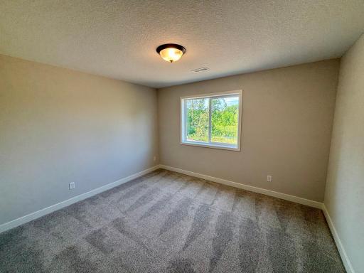 Bedroom 5/6 in Finished Walkout Basement - The Sedona at 920 Kepler Ave NE in Oakview Ridge!
