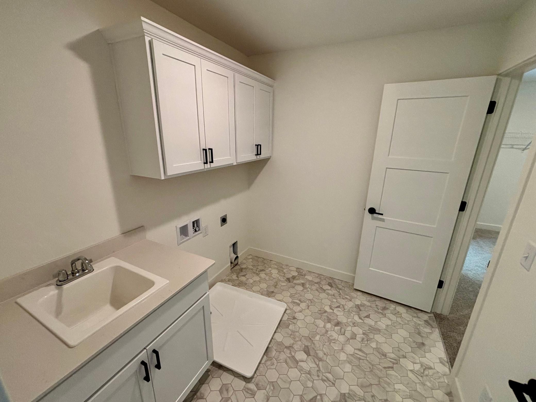 Walk-Thru Laundry Room - The Brookview at 819 Walnut Grove Lane in Oakview Ridge!