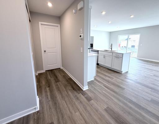 PHOTO OF A DIFFERENT HOME WITH SIMILAR PLAN AND FINISHES.
