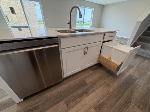 PHOTO OF A DIFFERENT HOME WITH SIMILAR PLAN AND FINISHES.