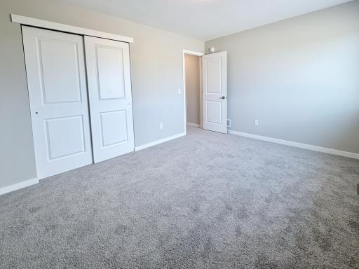 PHOTO OF A DIFFERENT HOME WITH SIMILAR PLAN AND FINISHES. Bedroom 3.
