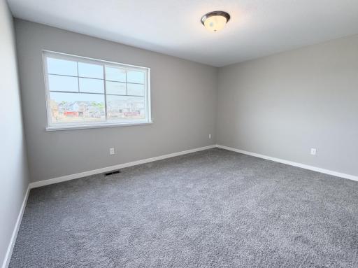PHOTO OF A DIFFERENT HOME WITH SIMILAR PLAN AND FINISHES. Bedroom 3.