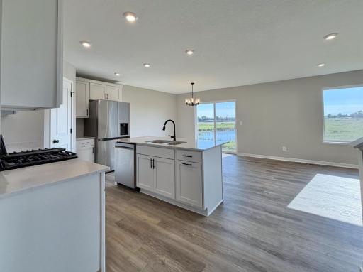 PHOTO OF A DIFFERENT HOME WITH SIMILAR PLAN AND FINISHES.
