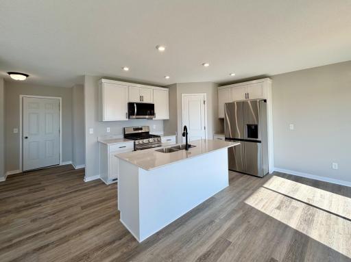 PHOTO OF A DIFFERENT HOME WITH SIMILAR PLAN AND FINISHES.