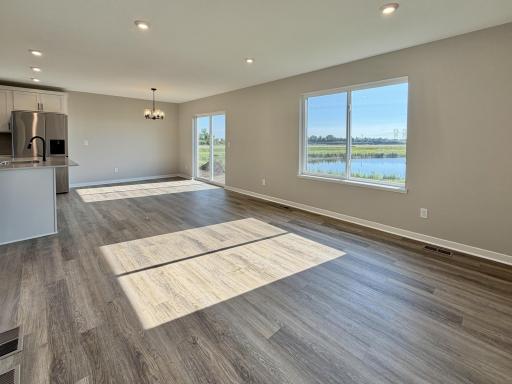 PHOTO OF A DIFFERENT HOME WITH SIMILAR PLAN AND FINISHES.