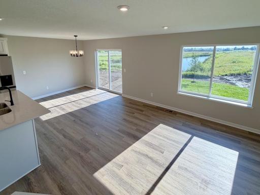 PHOTO OF A DIFFERENT HOME WITH SIMILAR PLAN AND FINISHES.