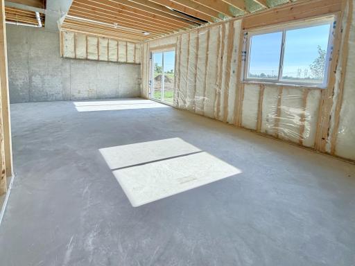 PHOTO OF A DIFFERENT HOME WITH SIMILAR PLAN AND FINISHES. Unfinished Walkout Lower Level ready for future finish including future family room, bedroom 4, and 4th bathroom.