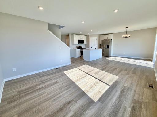 PHOTO OF A DIFFERENT HOME WITH SIMILAR PLAN AND FINISHES.