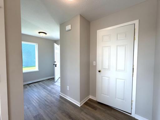 PHOTO OF A DIFFERENT HOME WITH SIMILAR PLAN AND FINISHES. Spacious Foyer with Window.