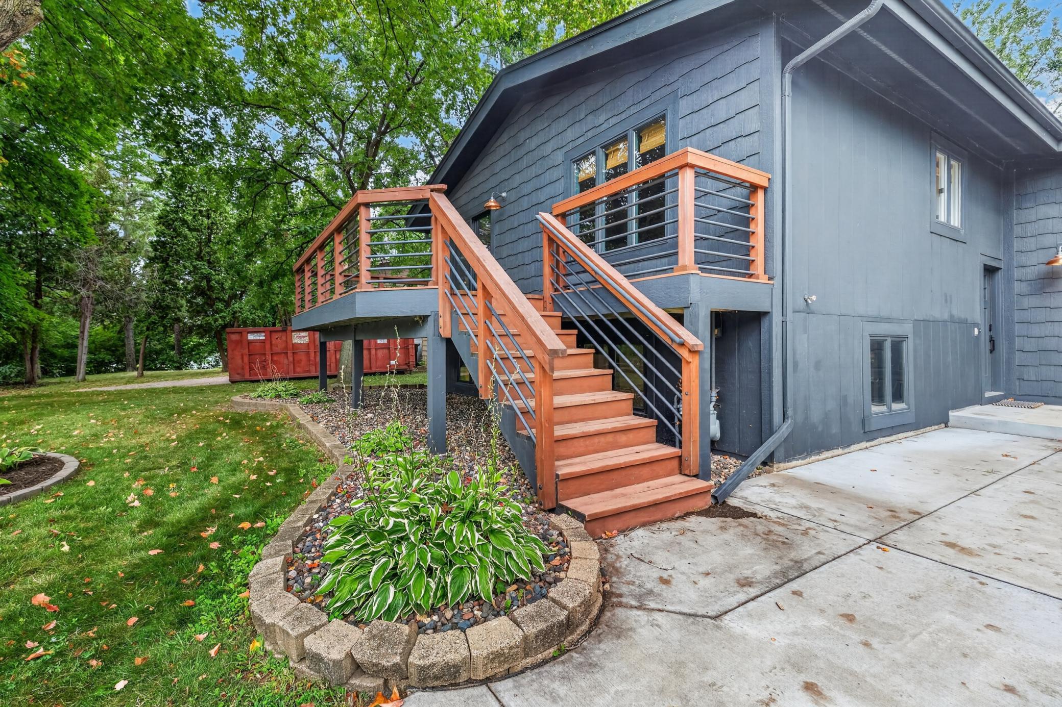 10x27 Deck off the front of the home with stairs to the property. Large concrete driveway