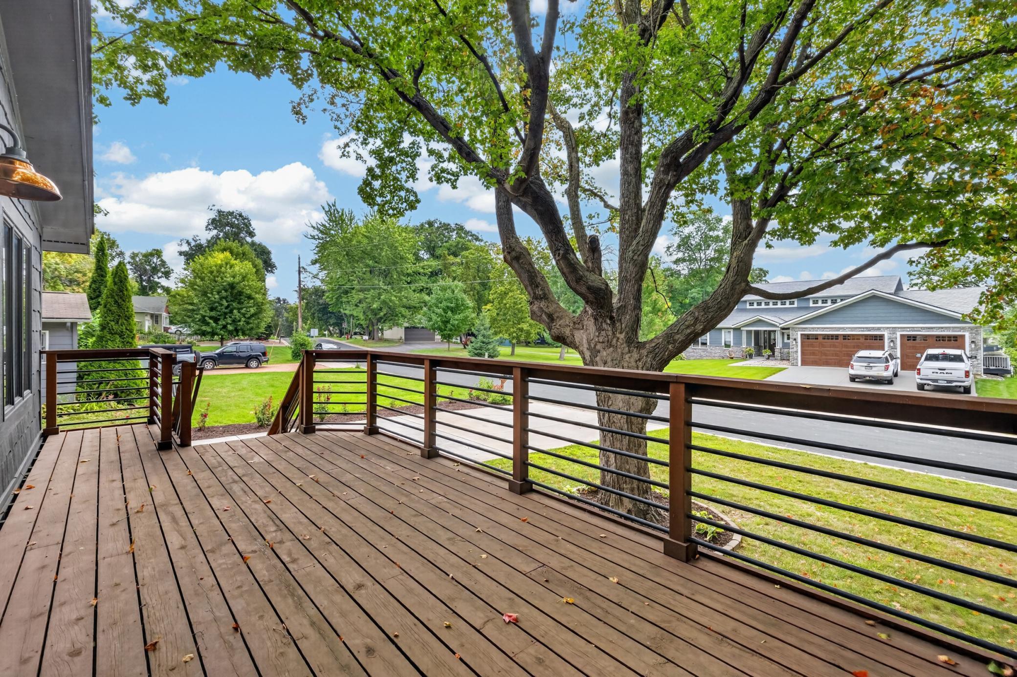 Enjoy lake views from the front facing deck w/ modern railing. Great size deck!