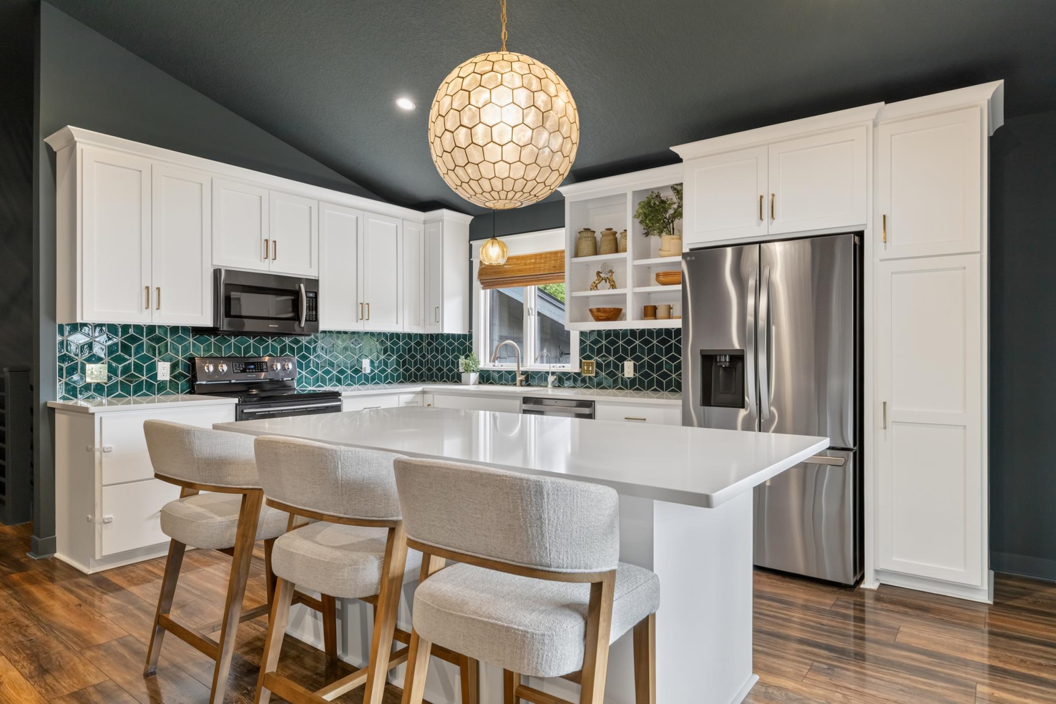 Appliances include a French door refrigerator, range, dishwasher and microwave