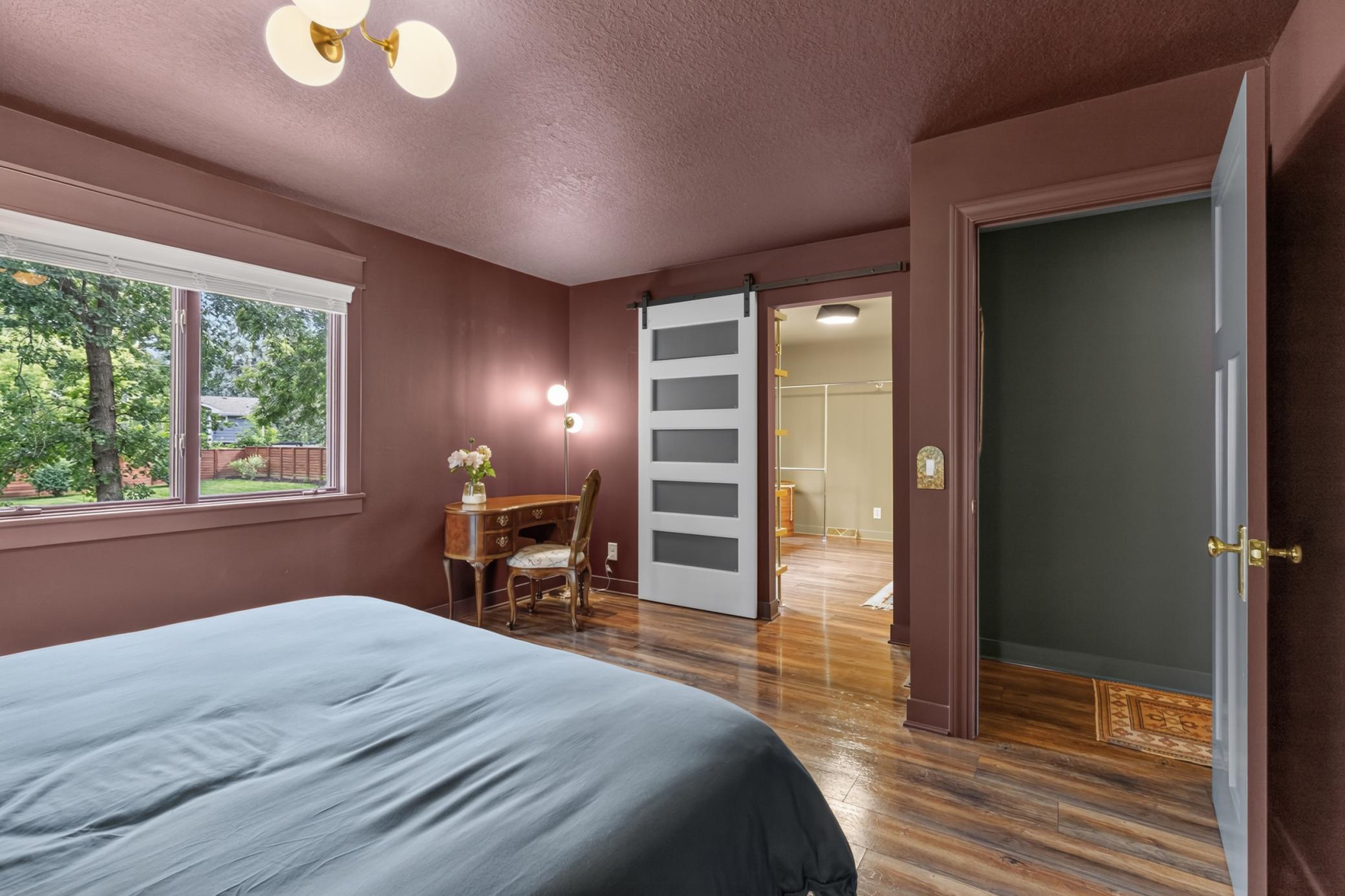 Master Bedroom features sliding barn door access to the oversized walk-in closet