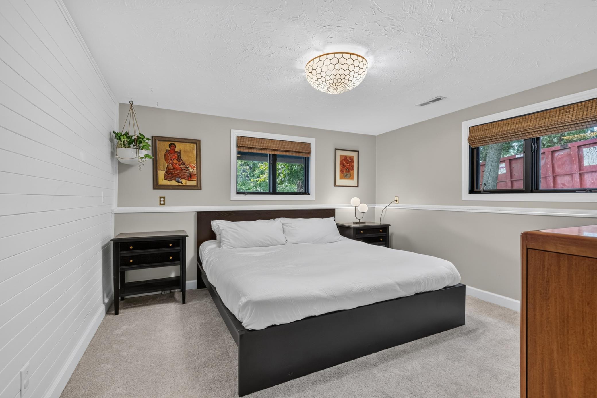 Bedroom 4 features shiplap accent wall and offers a walk-in closet