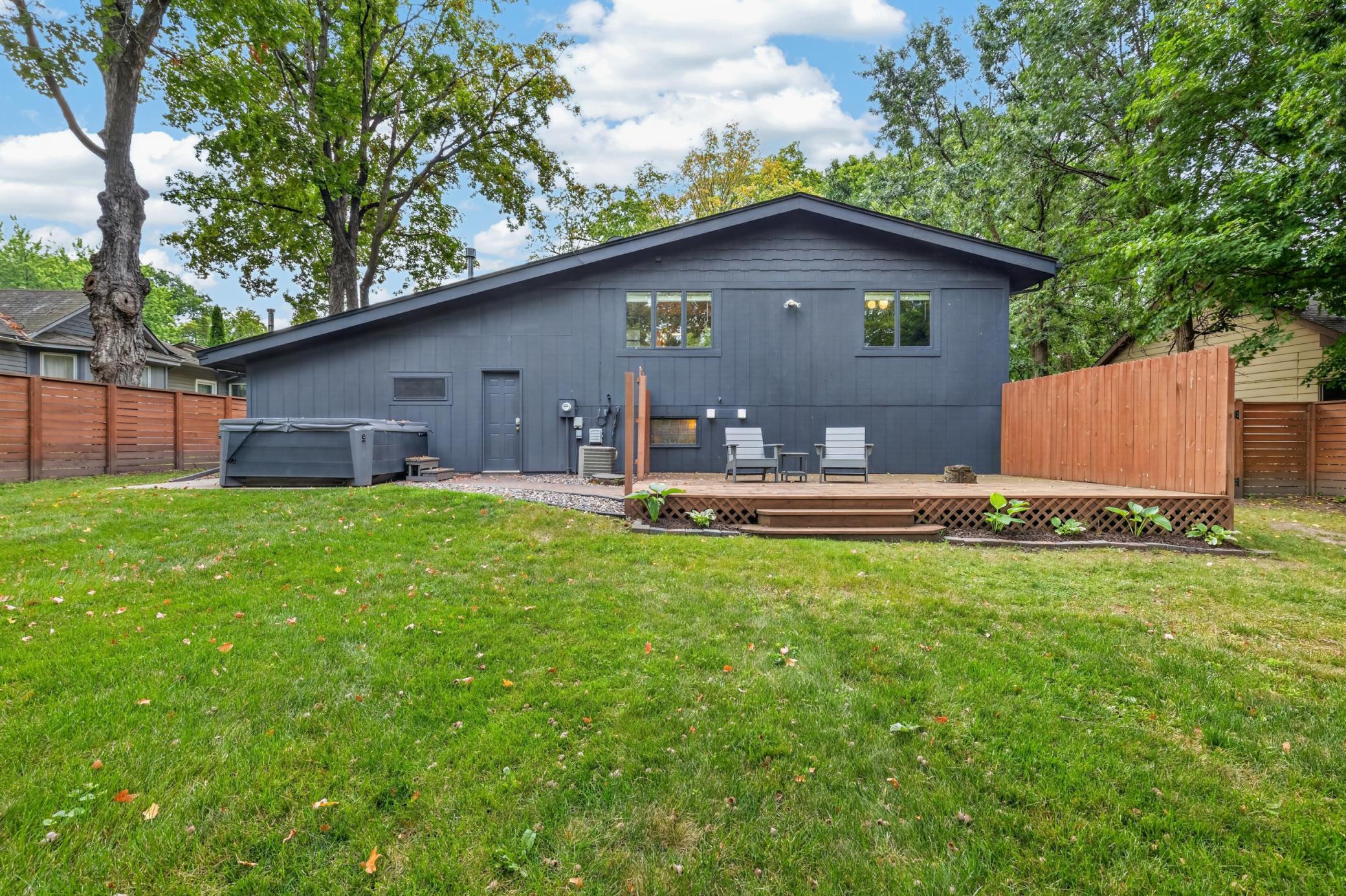 Relax & enjoy the private backyard on home's 2nd deck! Concrete patio which currently serves as a base for a hottub