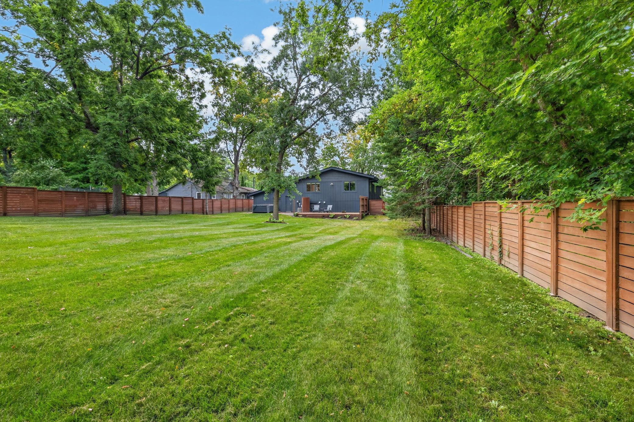 Enjoy mature trees, flower gardens and landscape!