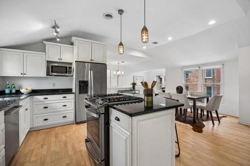 Stainless steel appliances complement the updated kitchen, adding a clean and modern touch.