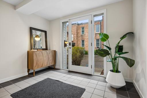 Spacious foyer with a welcoming entry and easy access to the home's open main living space.