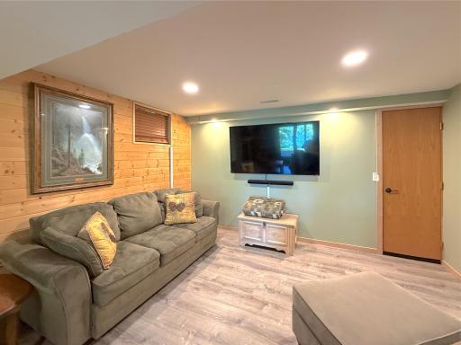 The spacious recreation room offers endless possibilities, whether you're hosting game nights, creating a home theater, or simply relaxing with family and friends.