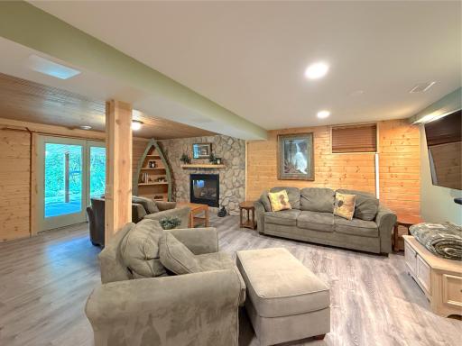 The spacious recreation room offers plenty of room for movie nights, game days, or entertaining family and friends, with an open layout that provides endless possibilities.