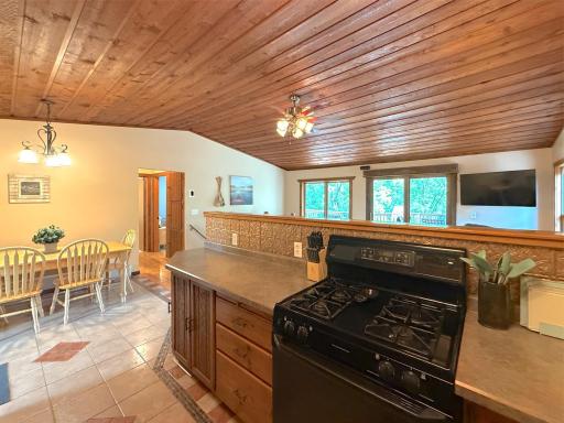 Open to the dining and living areas, the kitchen makes entertaining easy while keeping everyone connected and enjoying the lakeside views.