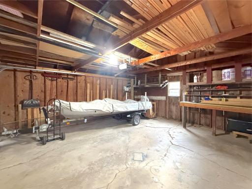 With electricity, built-in shelving, and generous workspace, the attached double garage is ready for projects, storage, and all your lake-life essentials.