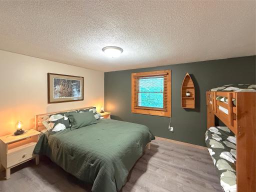 Perfect for lake weekends, the lower-level bedroom offers generous space to comfortably accommodate family and guests with great natural light and newer flooring.
