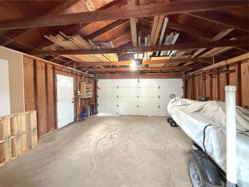 The attached double garage features electricity, an automatic garage door opener, and plenty of space for vehicles, lake toys, and everyday storage.