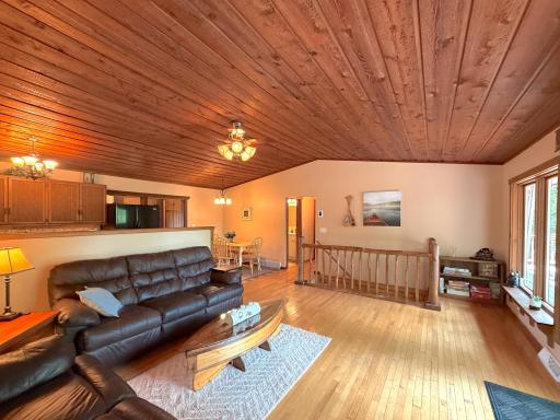 The open-concept living, dining, and kitchen areas are designed for effortless entertaining, blending rustic charm with comfortable everyday living.
