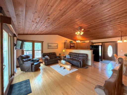 Relax in the spacious lakeside living room, where warm wood finishes and peaceful views create the perfect place to unwind after a day on the lake.