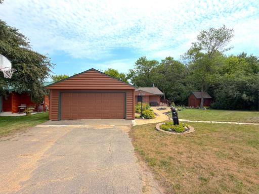 The attached double garage provides plenty of room for vehicles, lake toys, and extra storage, adding everyday convenience with an asphalt driveway.