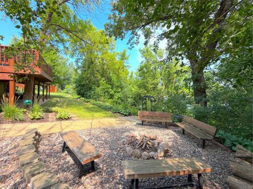 Gather around the inviting fire pit, surrounded by mature trees and beautifully landscaped grounds, for memorable evenings under the stars.
