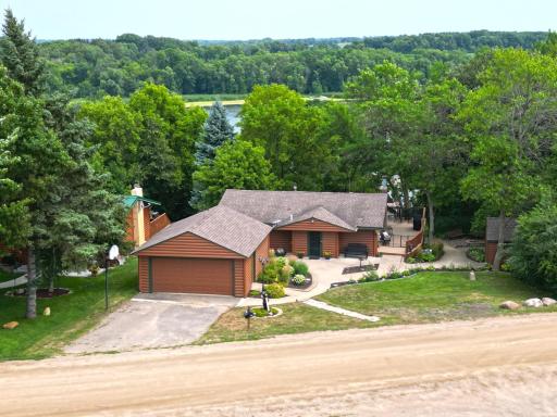 This charming half log home offers peaceful lake living with sweeping water views and beautifully landscaped outdoor entertaining spaces. Comes fully furnished and dock is included!