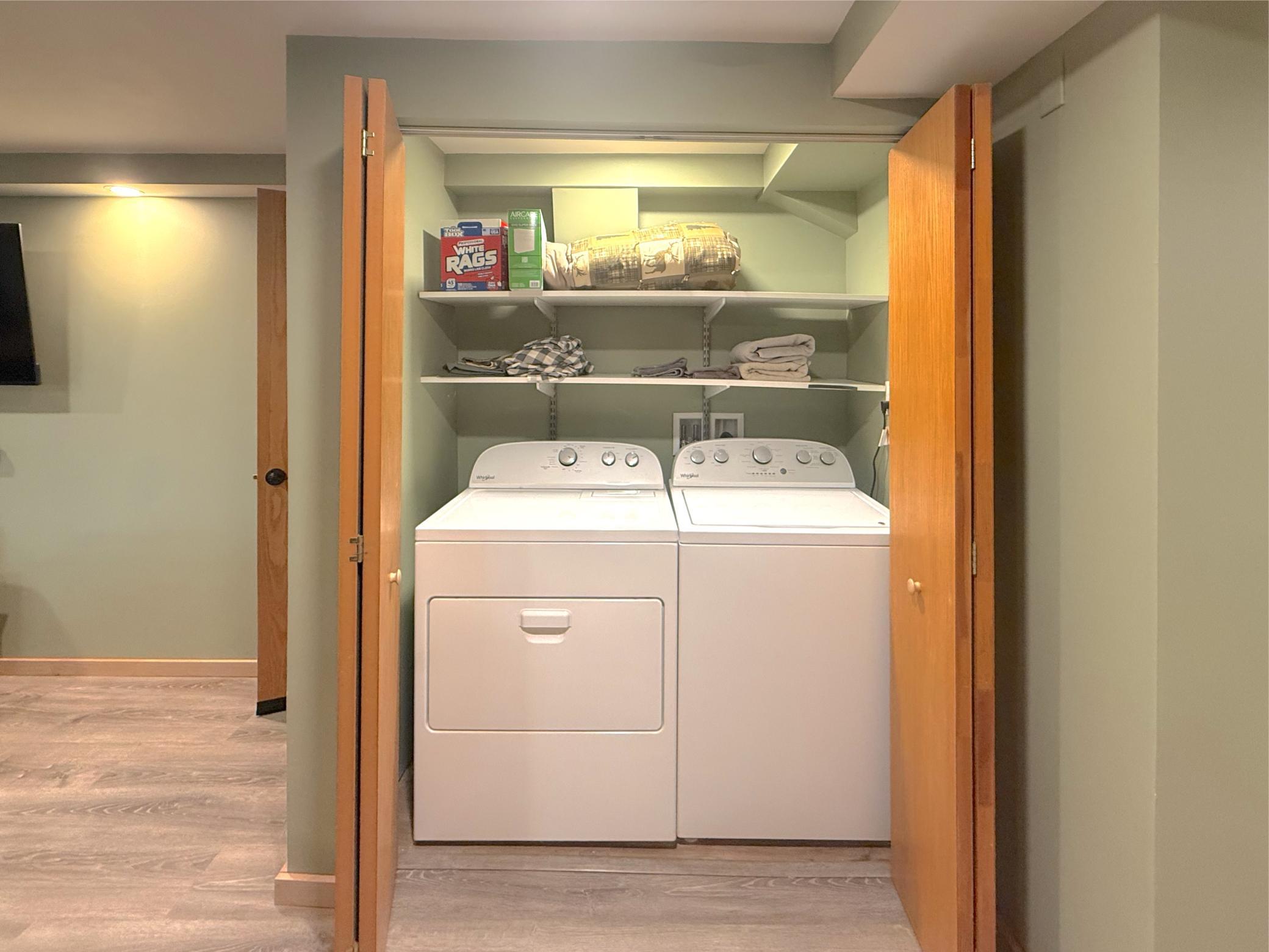 Enjoy the ease with a laundry room located in the lower level offering storage shelves and tucked away with bifold doors.