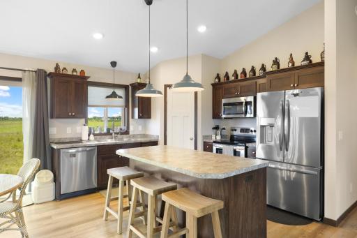 Stainless steel appliances, pantry, and center island for a great kitchen!