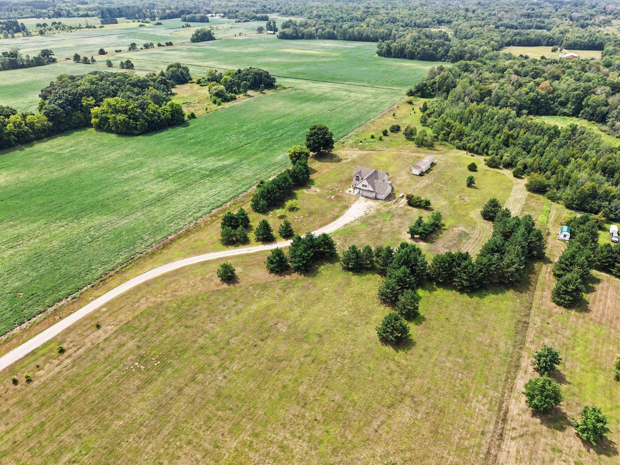 Long private driveway leads to the home, set well back from the road for added privacy.