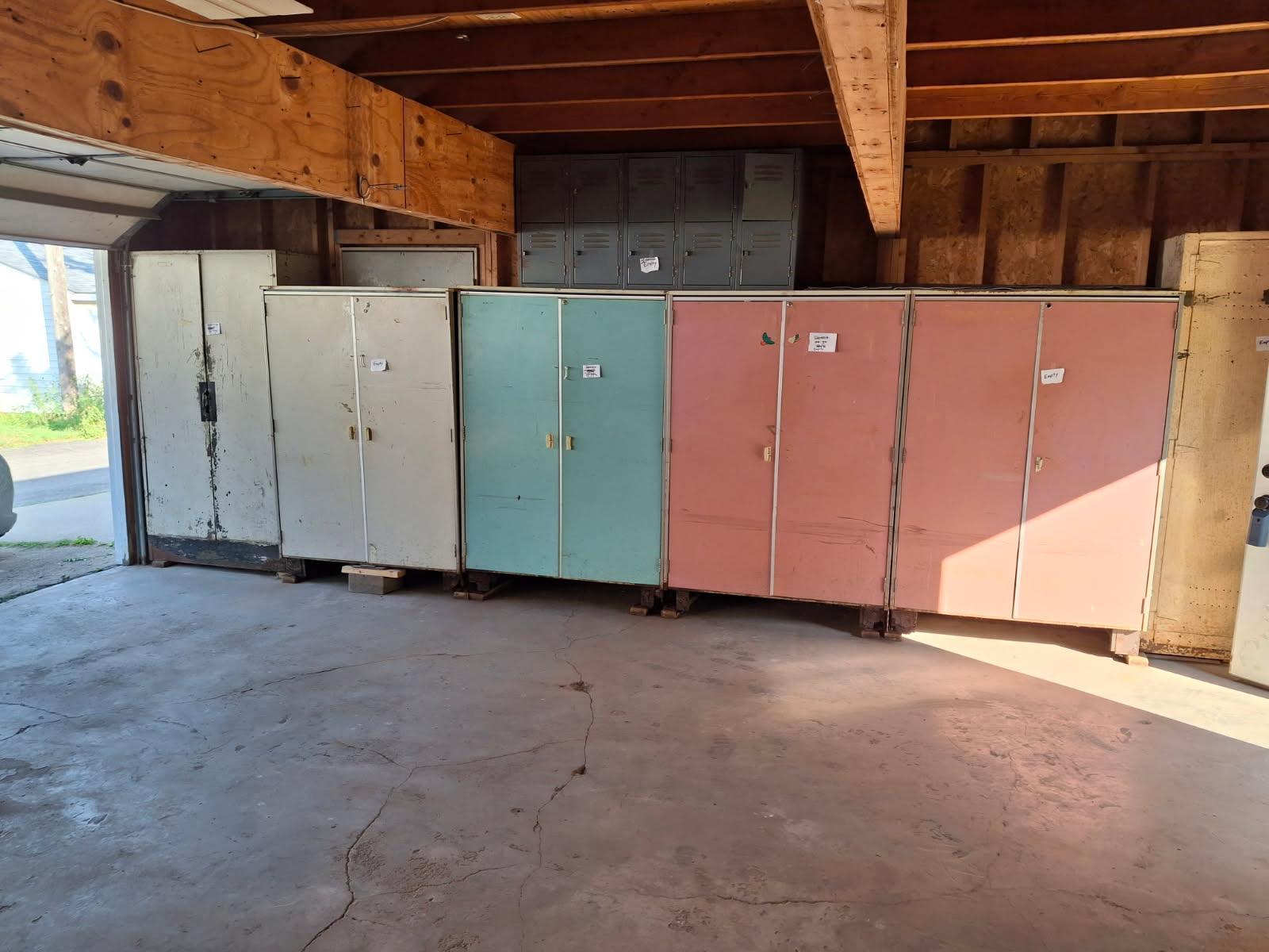 Garage interior side. Metal cabinets are freestanding and removable