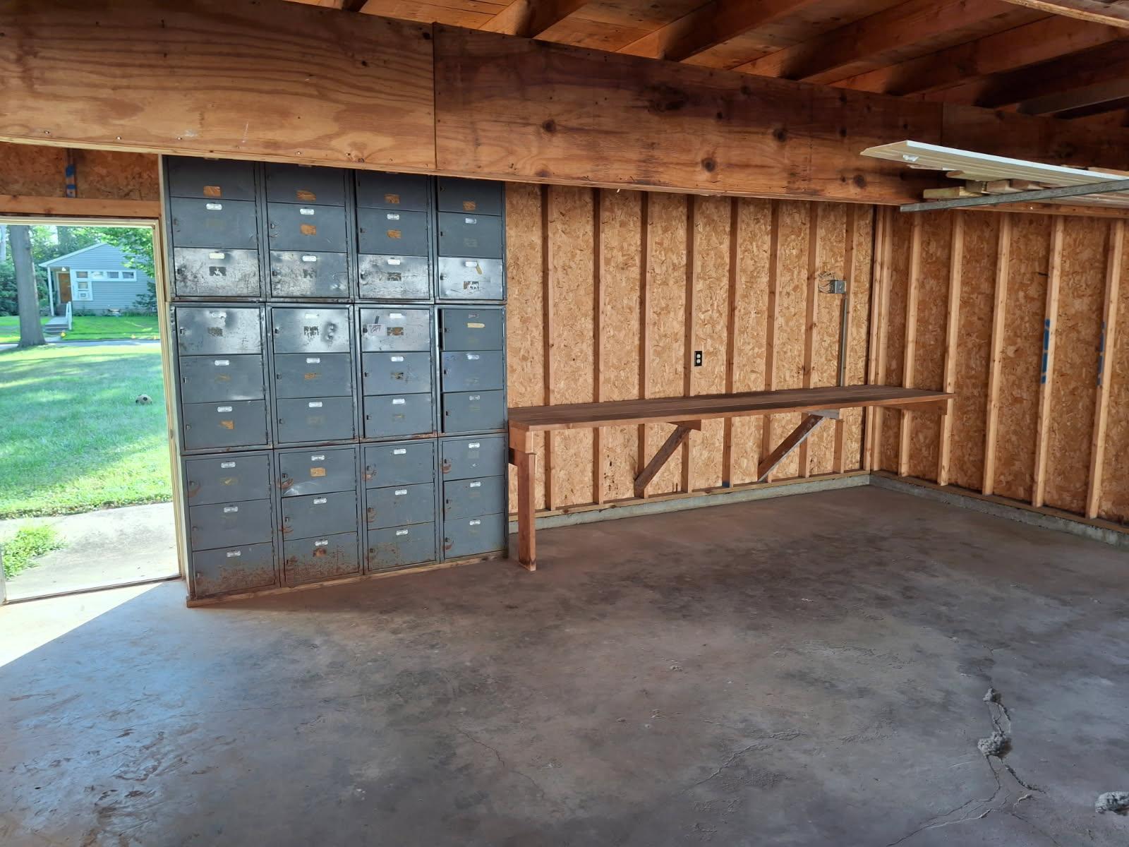 Garage interior rear. Metal cabinets are freestanding and removable.