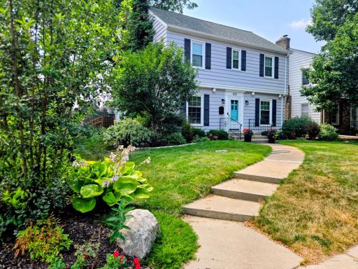 Classic curb appeal on a tree lined street