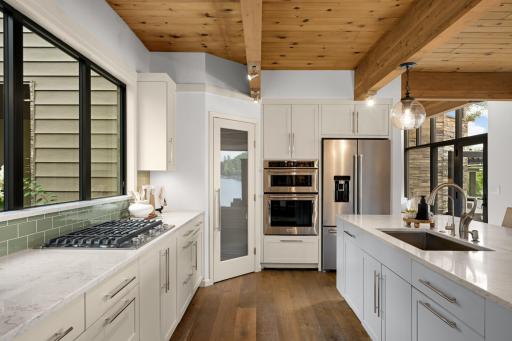 Gas Cooktop. Walk in Pantry. Front Window Overlooking the Greenery & Grounds. Pendant & Track Lighting!