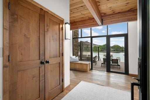 Inviting Front Entry w/Floor to Ceiling Glass, Wood Ceilings and LVP Flooring.