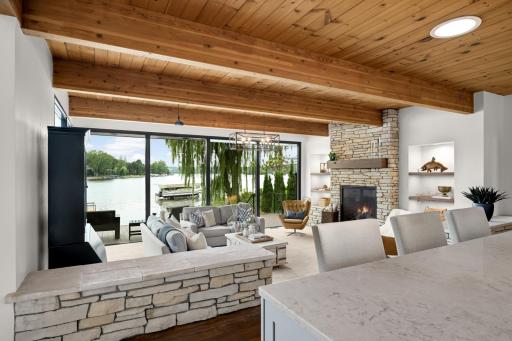 Serene Hearth Room just steps down from the Kitchen! Automatic Electric Blinds on the Lake Facing Windows!