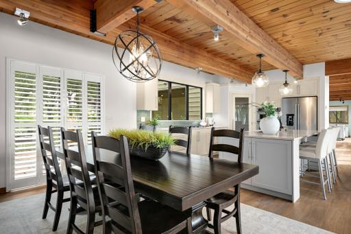 Spacious Dining Room w/Walk Out to the Front Yard. Custom Lighting & Wood Ceilings.
