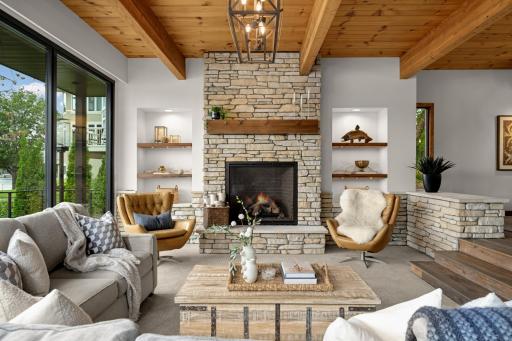 Hearth Room w/Sweeping Lake Views! Raised Hearth Gas Fireplace w/Extensive Stone Work. Beamed Ceilings.