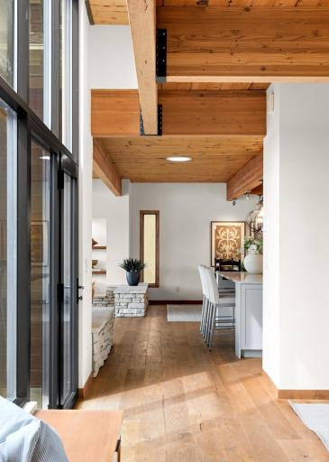 Spacious Hallways w/LVP Flooring, Floor to Ceiling Glass, Wood Ceilings & More.