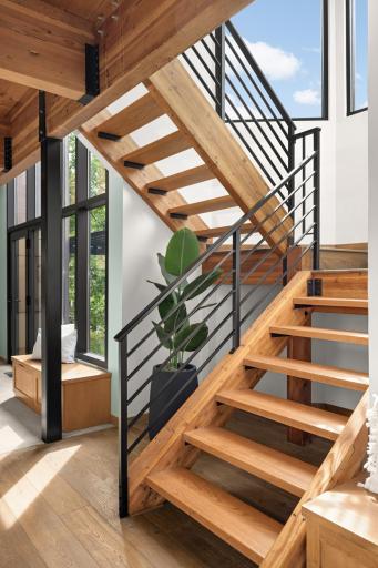 Open 2 Story Stairs to Upper Level w/Floor to Ceiling Glass.