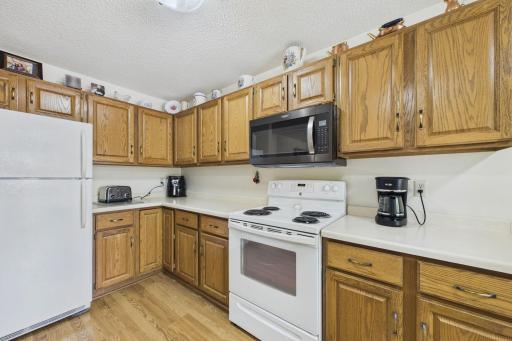 The kitchen has plenty of cabinets and counter space.